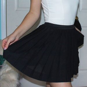 Pleated black mini skirt